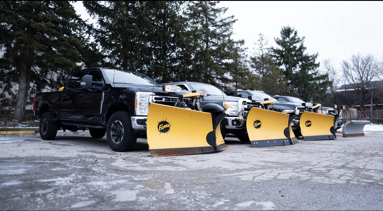 The London City Property Maintenance plow truck fleet lined up