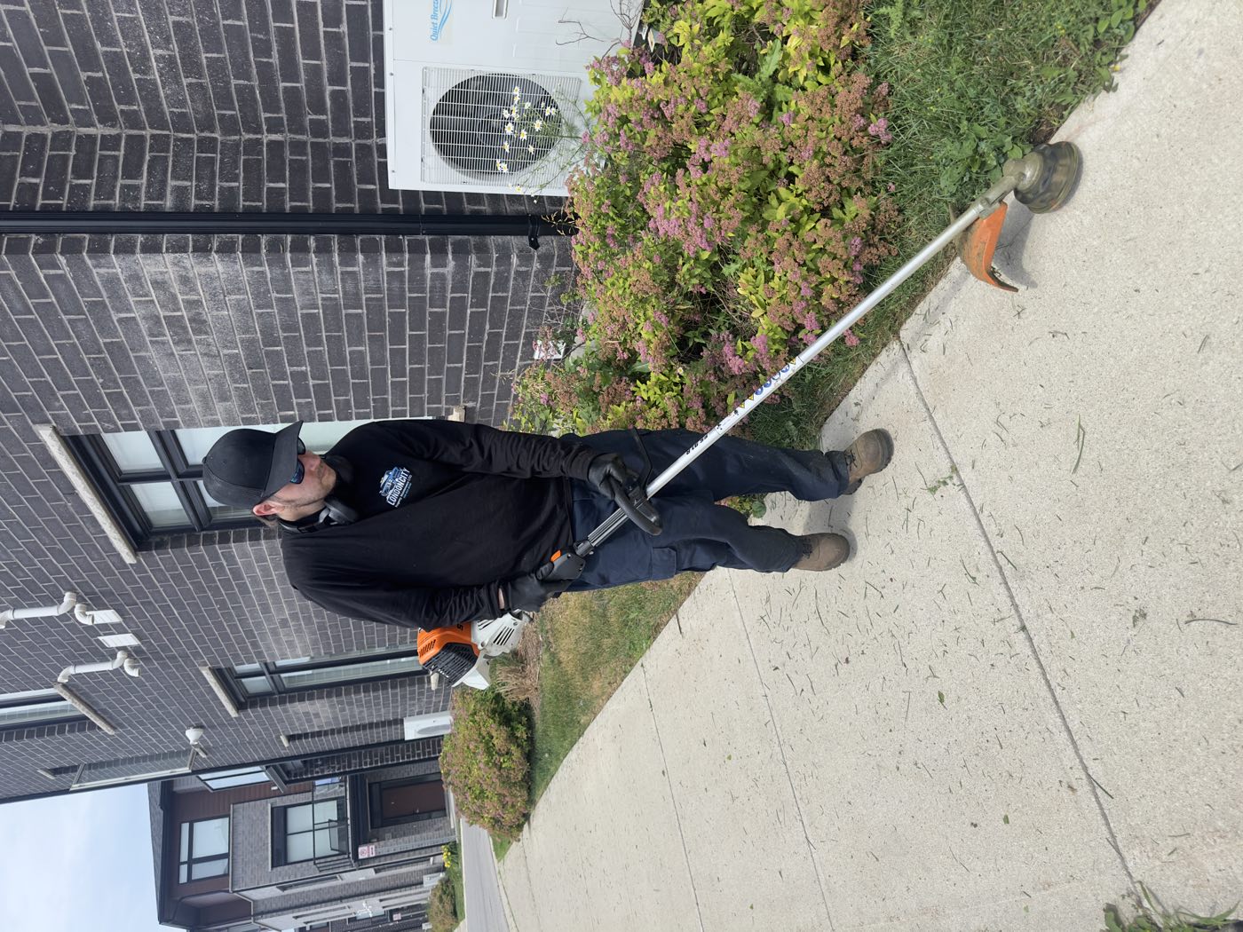 Ty edging a walkway at a multi-residential property